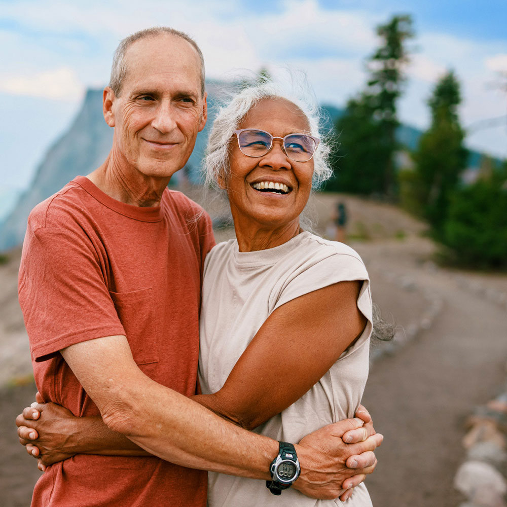 Couple embrace during a hike