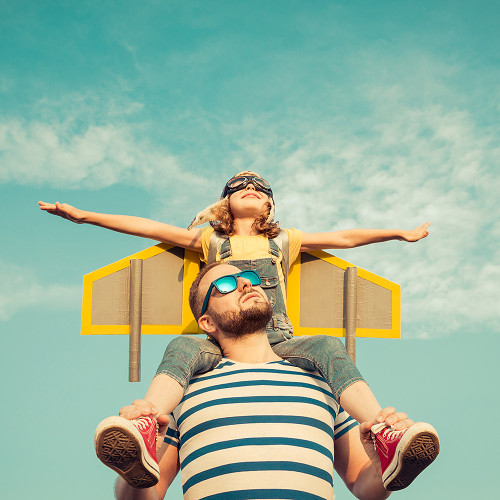 father and daughter playing as a rocketship