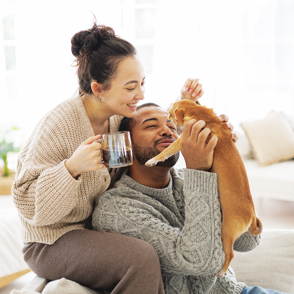 couple with puppy