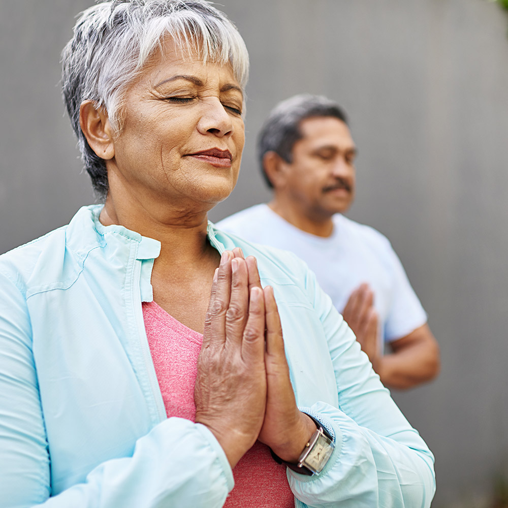 Older couple doing yoga