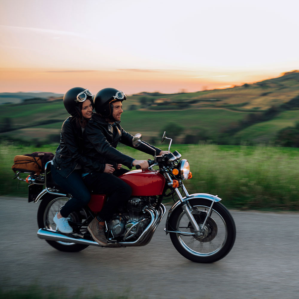 young couple on vintage motorcycle