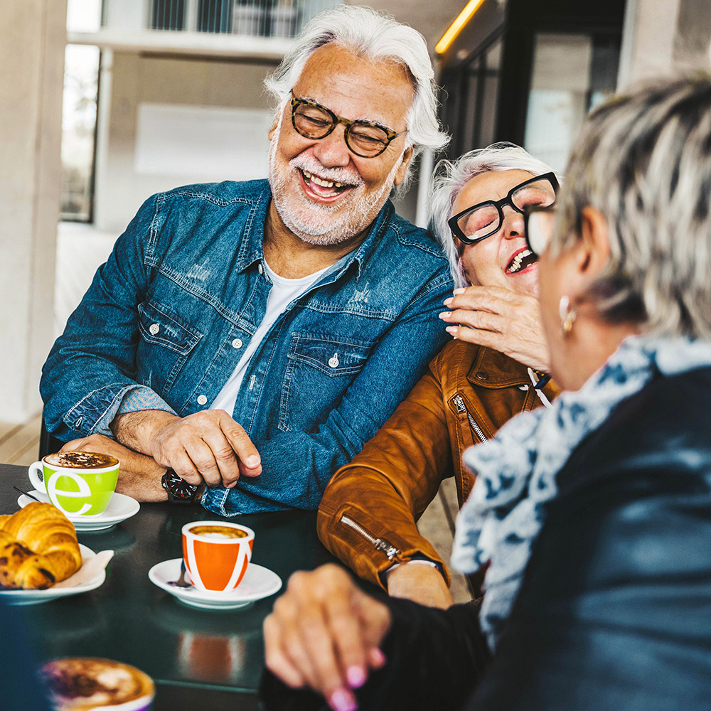 Group of older friends having breakfast