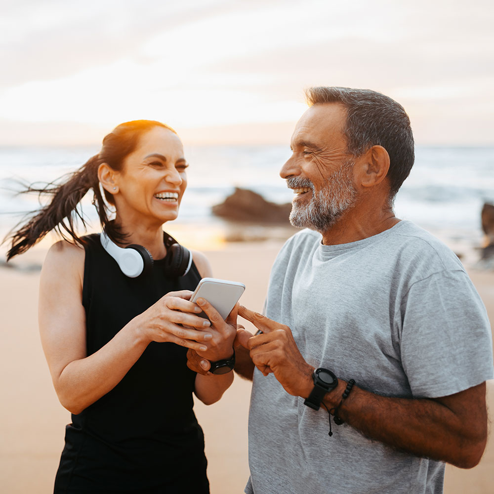 Active couple on beach
