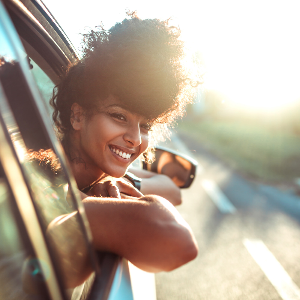 Woman in car looking out window