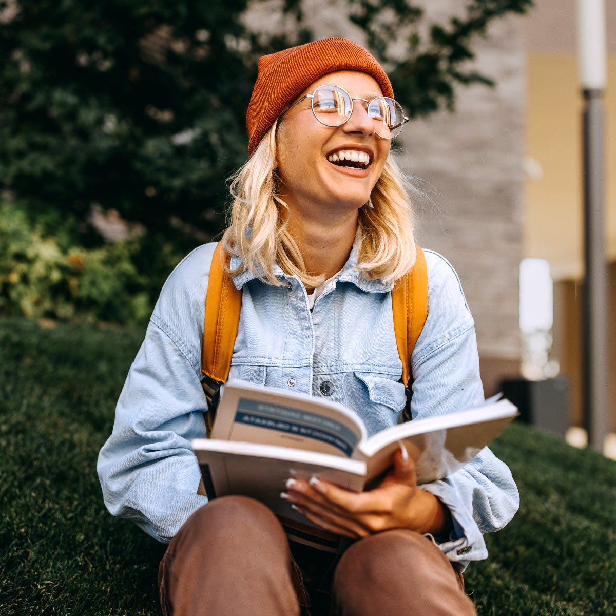 Young woman reading outdoors