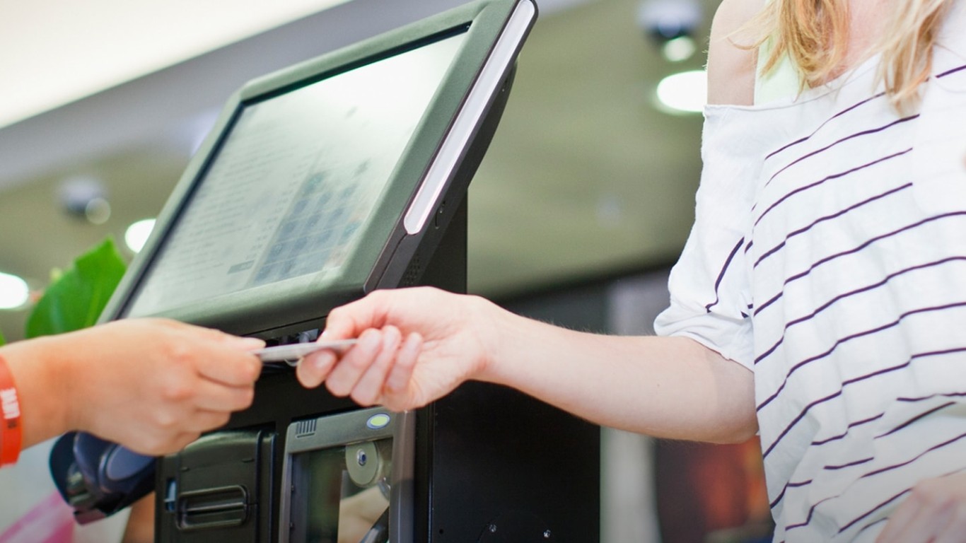 woman using a credit card to pay