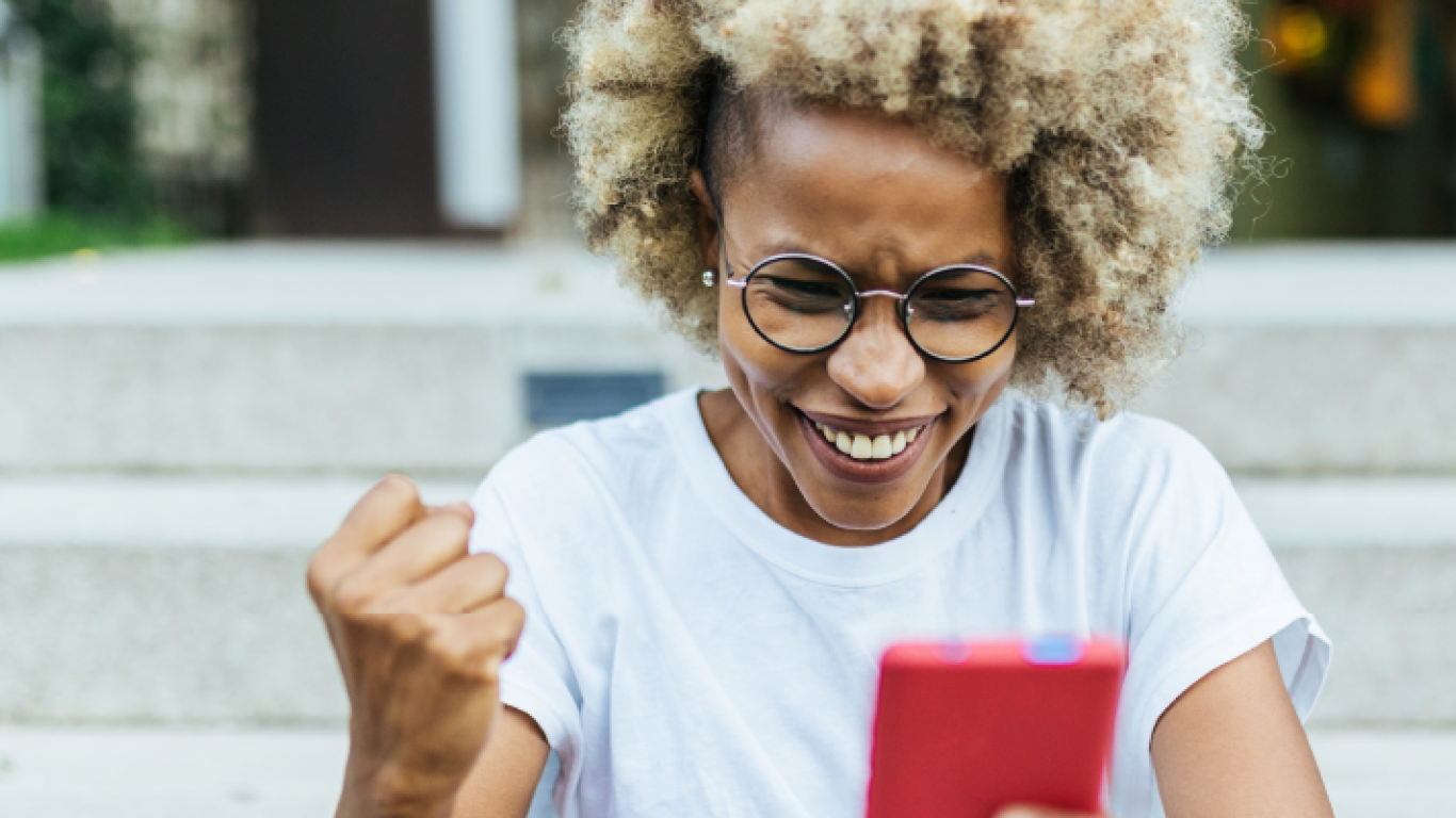 woman smiling at phone 