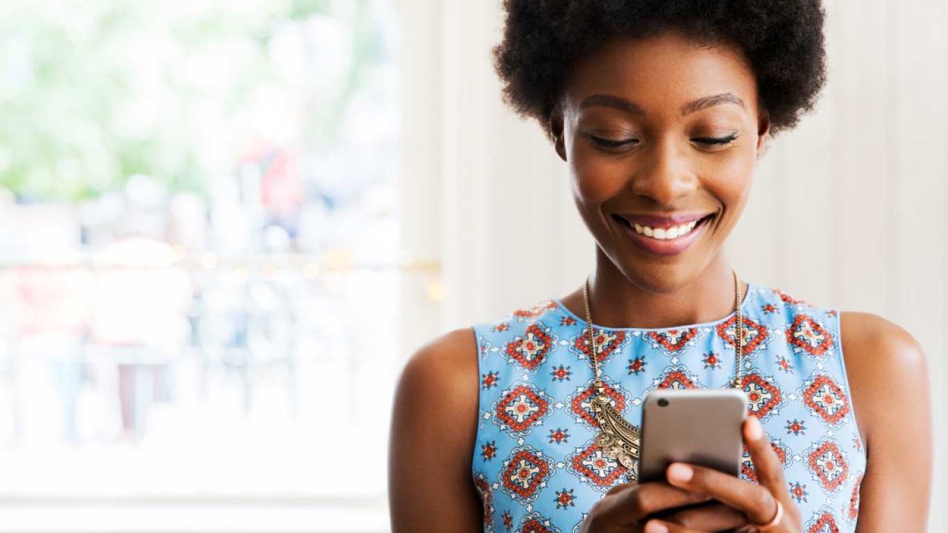 women smiling at phone
