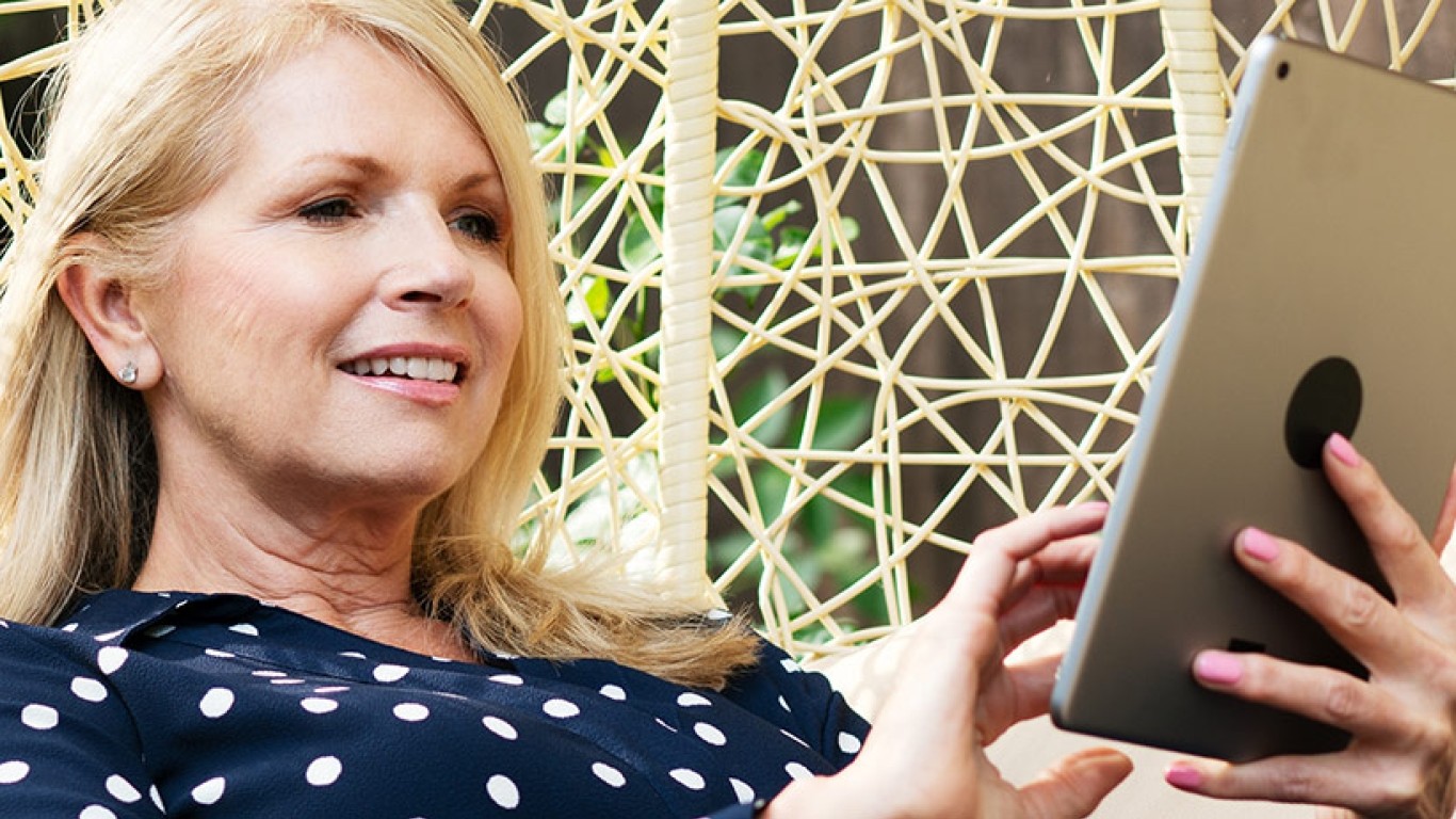 Woman outdoor relaxing with tablet