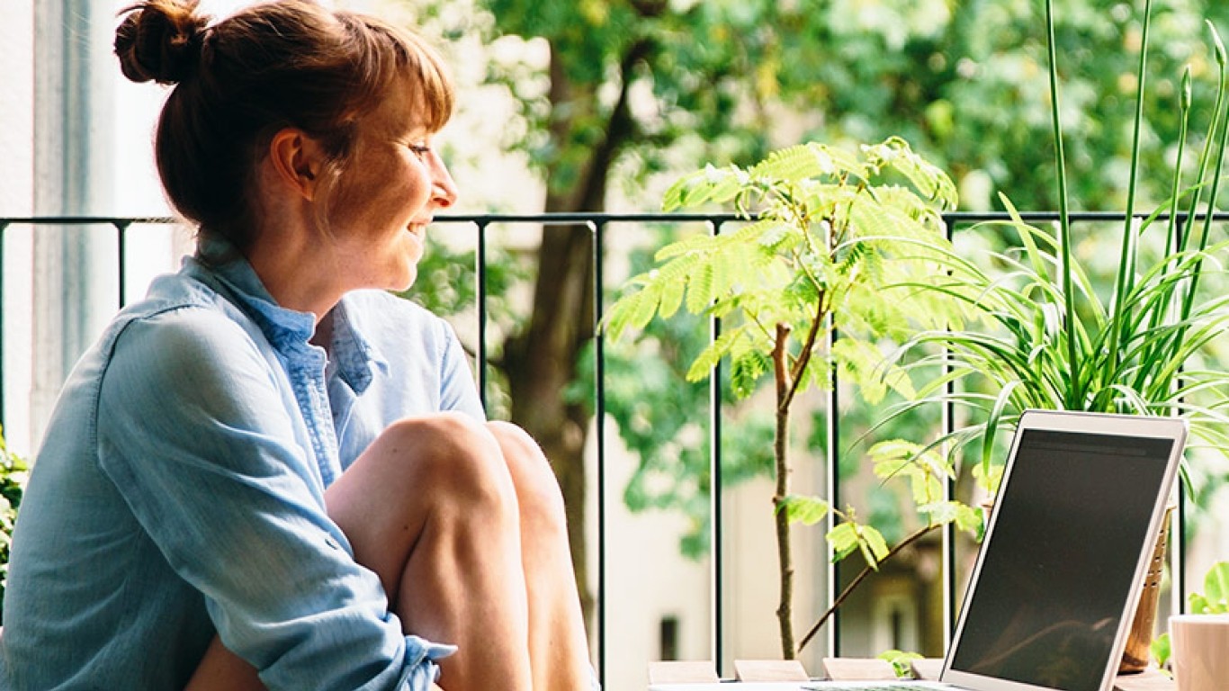 woman on patio with laptop