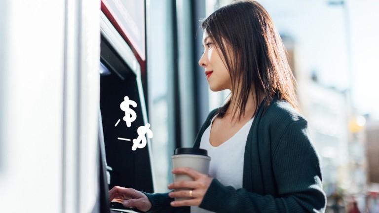 Woman uses atm at a credit union