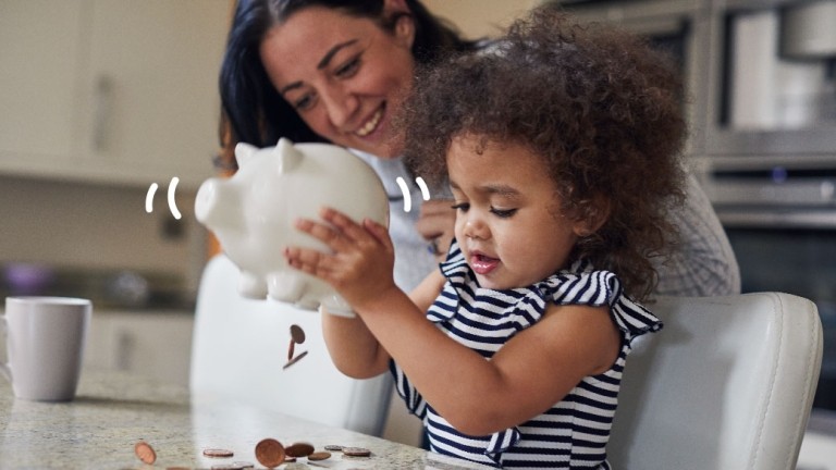 Mother and child with piggy bank