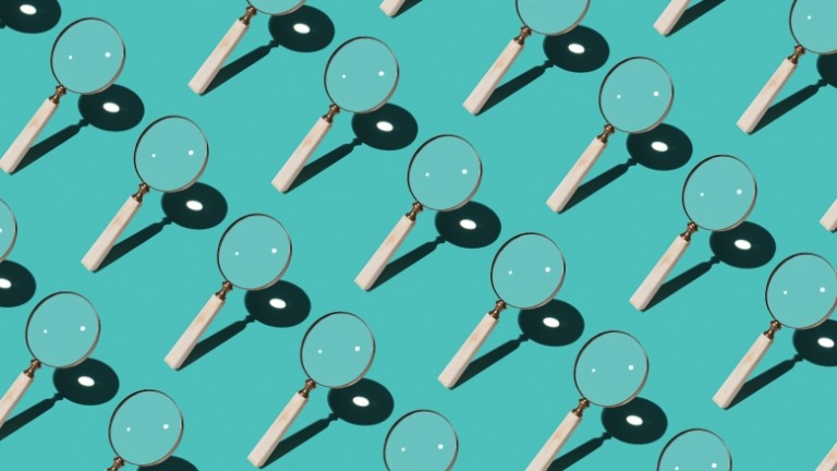 Magnify glasses arranged in a diagonal pattern over a blue background.