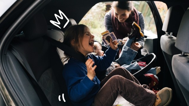 Kids playing in the back seat of the car