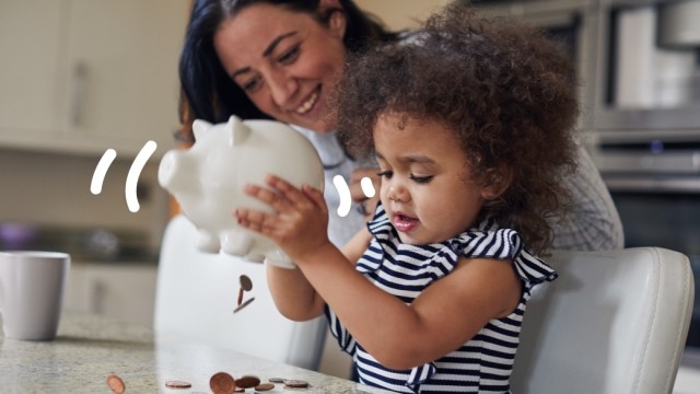 Child holds a piggy bank with squiggles in the air. 