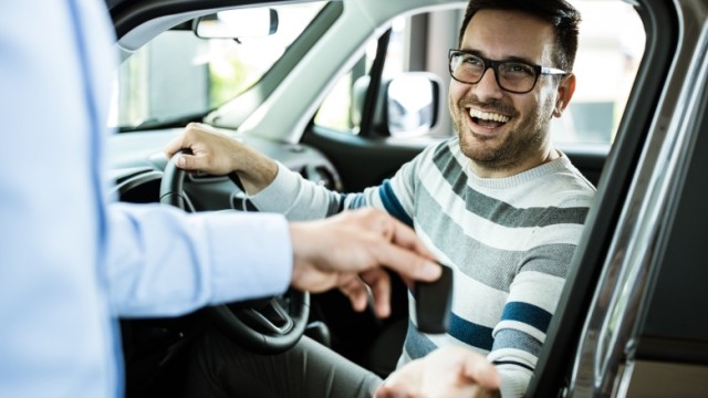 man in car
