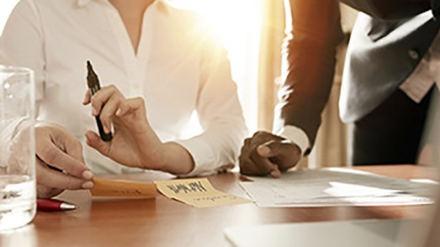 two people working at a table