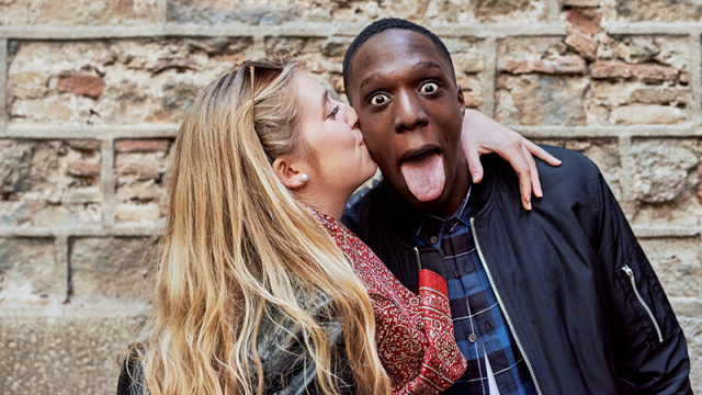 Woman kissing a man on the cheek