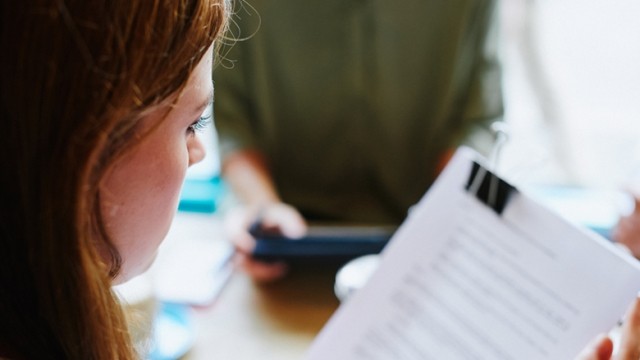 woman reviewing student loan paperwork