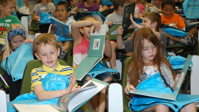 Kids reading books at Gift of Literacy