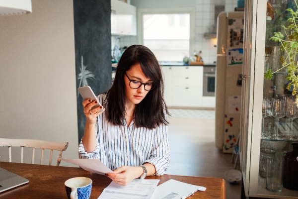 Woman looking at bills