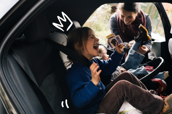 Kids playing in the back seat of the car