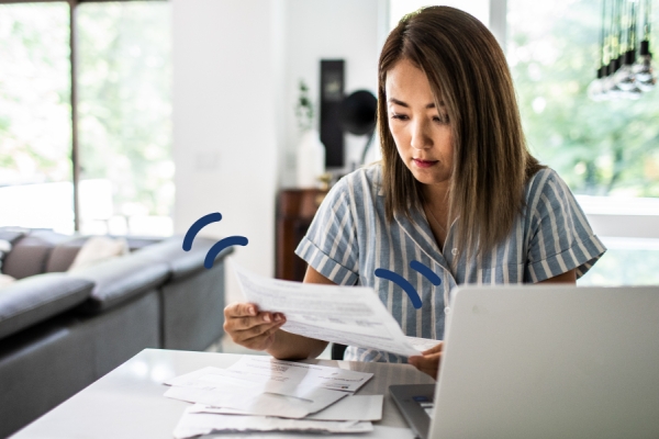 Woman looking at bills