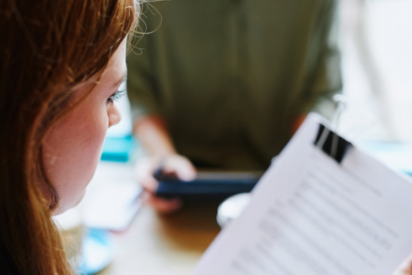 woman reviewing student loan paperwork