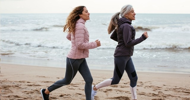 women running on the beach