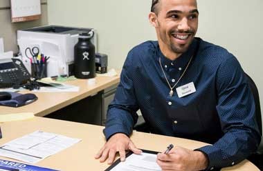Staff working with a credit union member