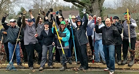 Groups of employees volunteer yardwork