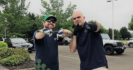 men with work gloves gesturing