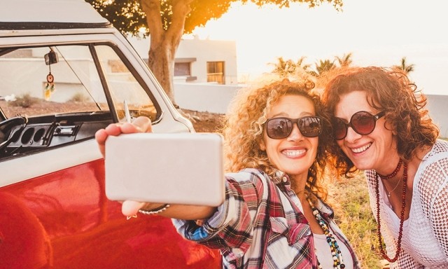 Women on a road trip in old VW bus