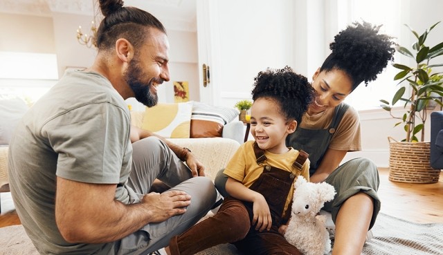 couple on living room floor with kids