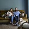 couple on couch with dogs